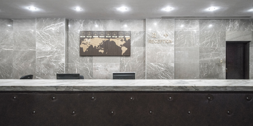One Voice Mail. Photo by Random Institute on Unsplash. Hotel reception desk.