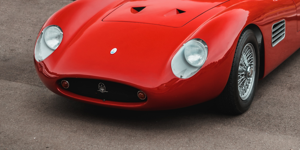 Accumulator_Photo by Tim Meyer on Unsplash. Shows close crop of red Ferrari